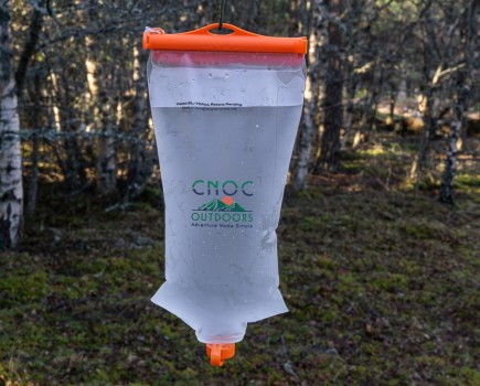 CNOC Outdoors hiking water bag hanging in the woods