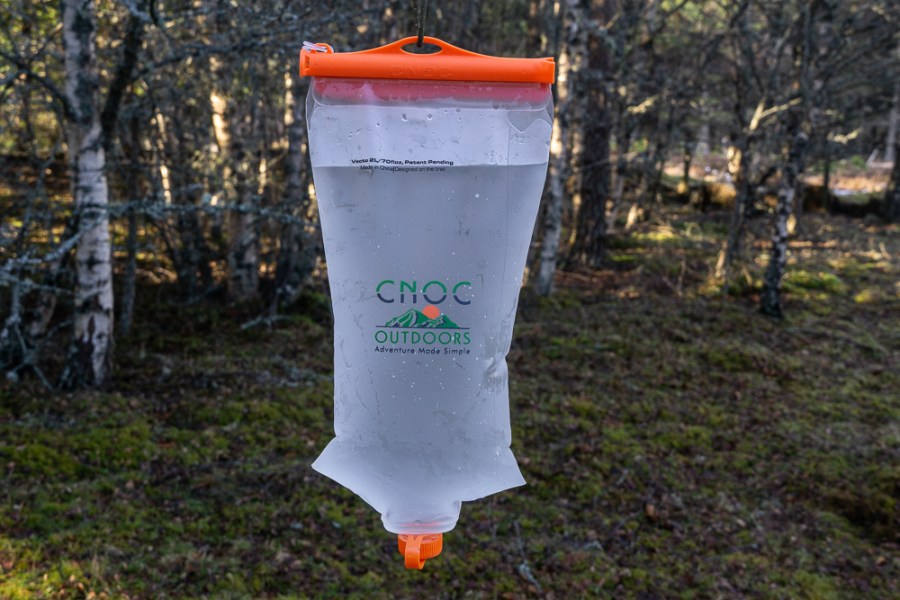 CNOC Outdoors hiking water bag hanging in the woods