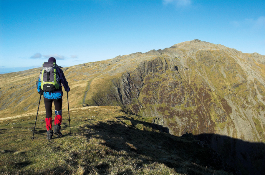 Man standing on top of a mountain in snowdonia