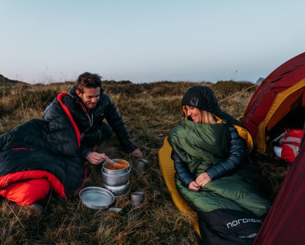 A couple testing out types of sleeping bag