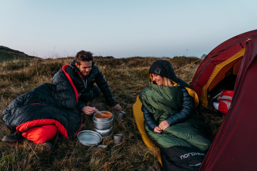 A couple testing out types of sleeping bag