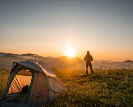 A tent with alternates to sleeping bags tucked inside_pexels-cliford-mervil-2398220