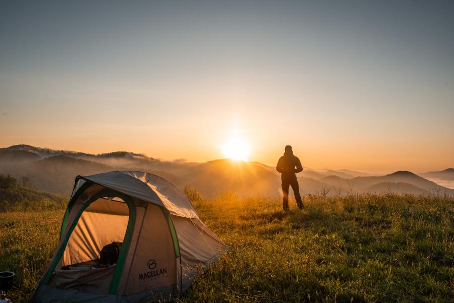 A tent with alternates to sleeping bags tucked inside_pexels-cliford-mervil-2398220