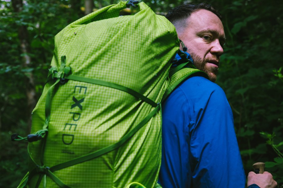 James Forrest using an Exped backpack cover