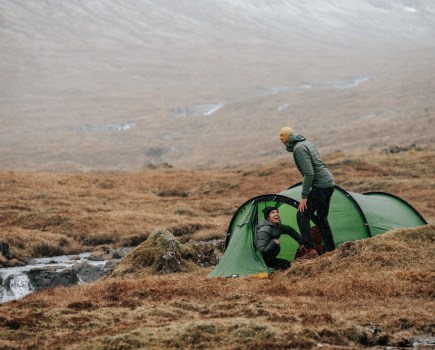 Two people camping in the hills of the Faroe Islands