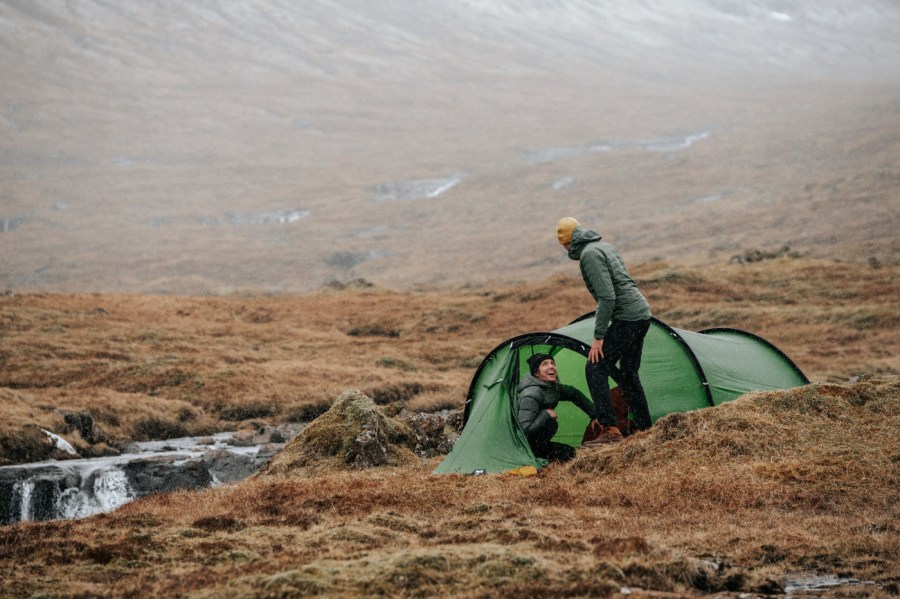 Two people camping in the hills of the Faroe Islands