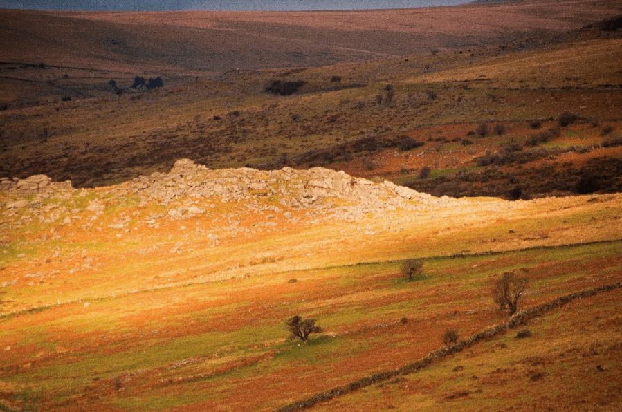 A shaft of sunlight bursts across Ingra Tor