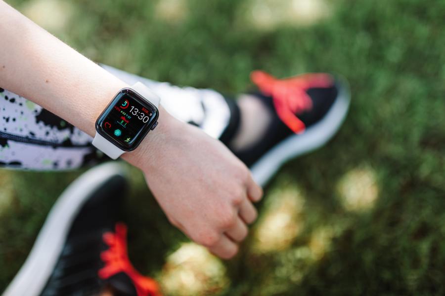 A woman using a fitness watch 