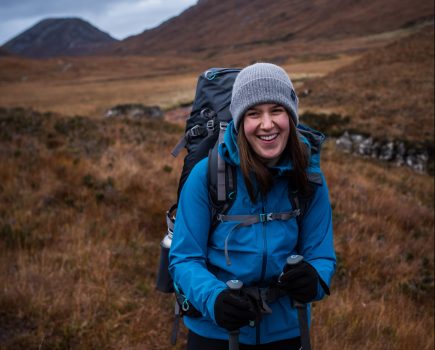 Iona Andean testing out her gloves' warmth and waterproofing in the Grey Corries. Credit: Jessie Leong