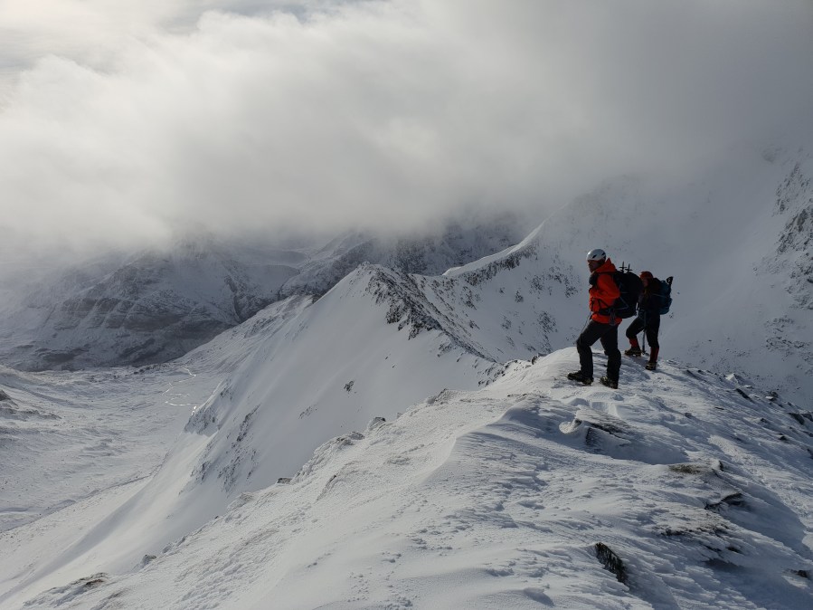 Climbers enjoying the view before the cloud on Ben Nevis CMD arete