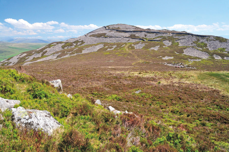 7: View looking back to Tre’r Ceiri on the climb to Garn Goch – the protective stone walls are clearly seen and this is one of the finest Iron Age forts in Europe.JPG
