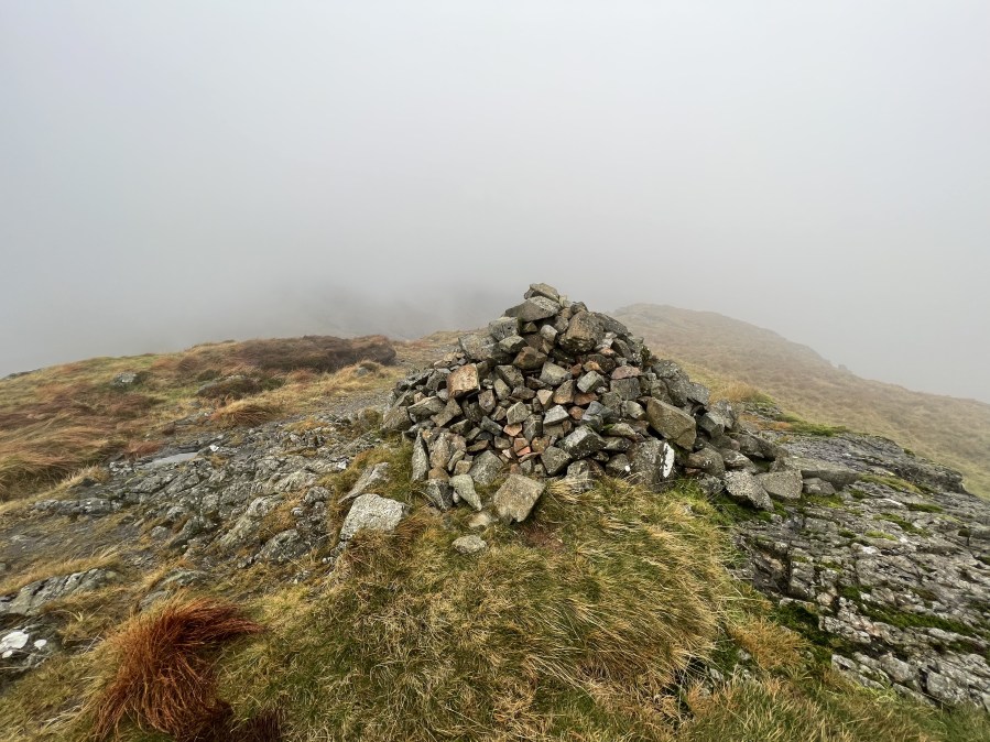 The Yewbarrow summit cairn shrouded in cloud