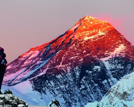 Evening colored view of Mount Everest from Gokyo valley with tourist on the way to Everest base camp, Sagarmatha national park, Khumbu valley, Nepal