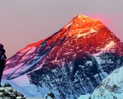 Evening colored view of Mount Everest from Gokyo valley with tourist on the way to Everest base camp, Sagarmatha national park, Khumbu valley, Nepal