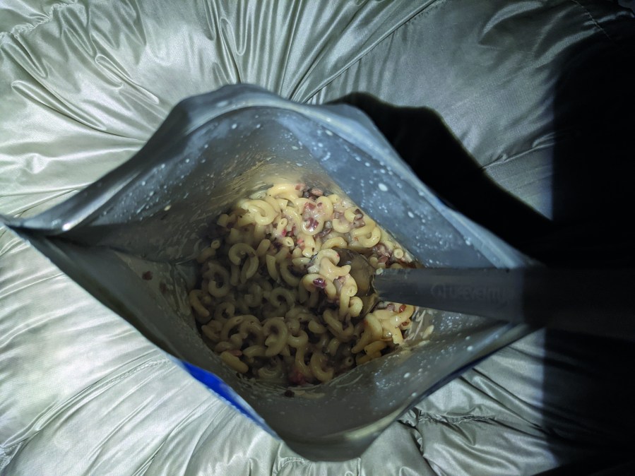 cooking in camp - Rehydrating a dehydrated meal pouch.Credit: Alex Roddie