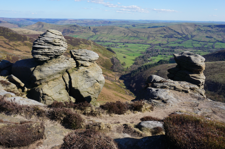 Kinder Low - Views through the Nether Tor rock formations down to Edale.jpg