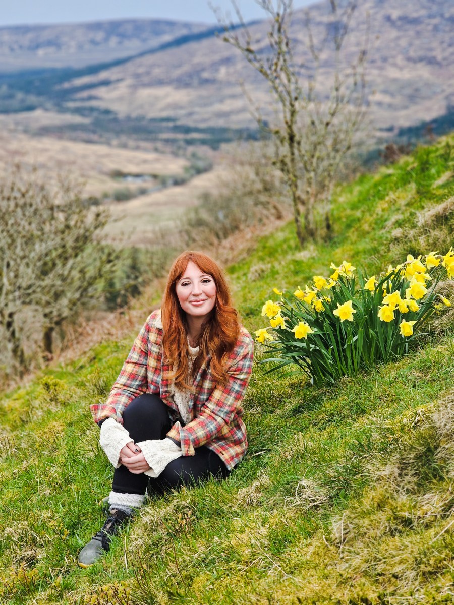 Kate Appleby among the daffodils on Scottish hills.