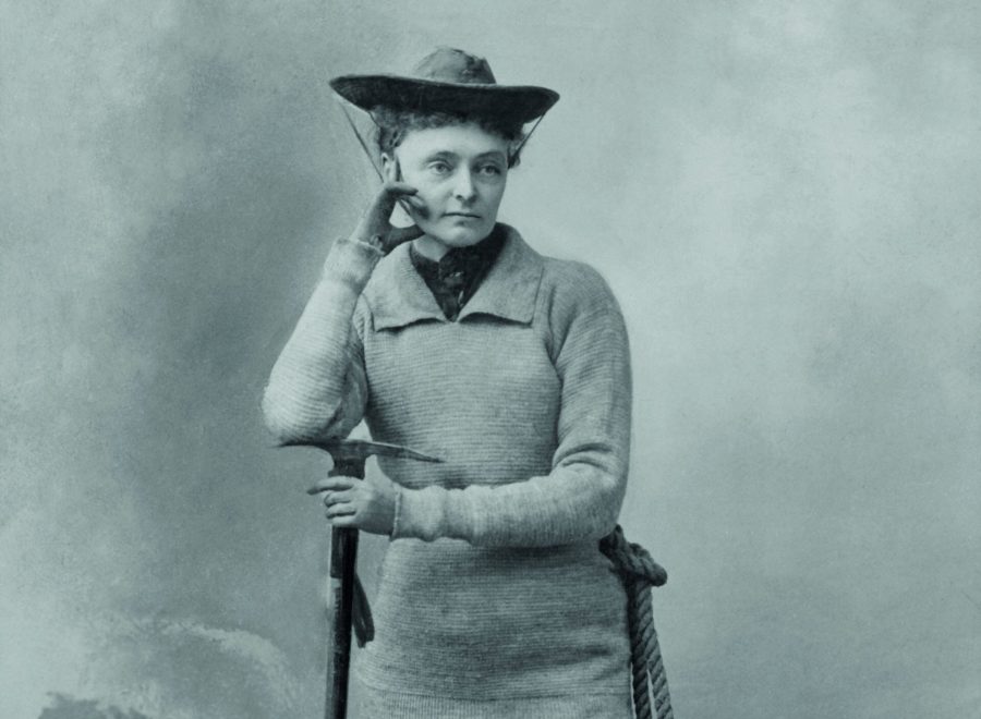 suffragette mountaineer Miss Annie S. Peck, in her mountaineering gear, 1911. She wears a tunic sweater over trousers tucked into gaiters over climbing boots. In 1895, her masculine climbing costume was scandalous. In 1908, at the age of 58, she climbed Peru's Mount, reaching the height of 21,812, higher than and man or women had climbed to that date. Her claim was contested by Fanny & William Hunter Workman (BSLOC_2018_4_204)