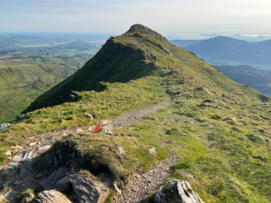 The summit of Cnicht adorned with an Ultra Marathon Snowdonia flag