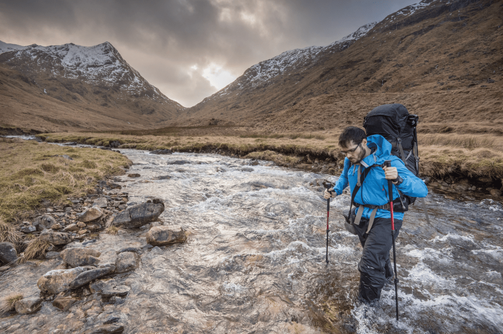 Alex Roddie tackling a Cape Wrath trail river crossing.