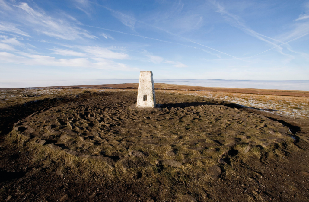 Pendle summit trig pillar overlaid on a Bronze Age burial mound.jpg