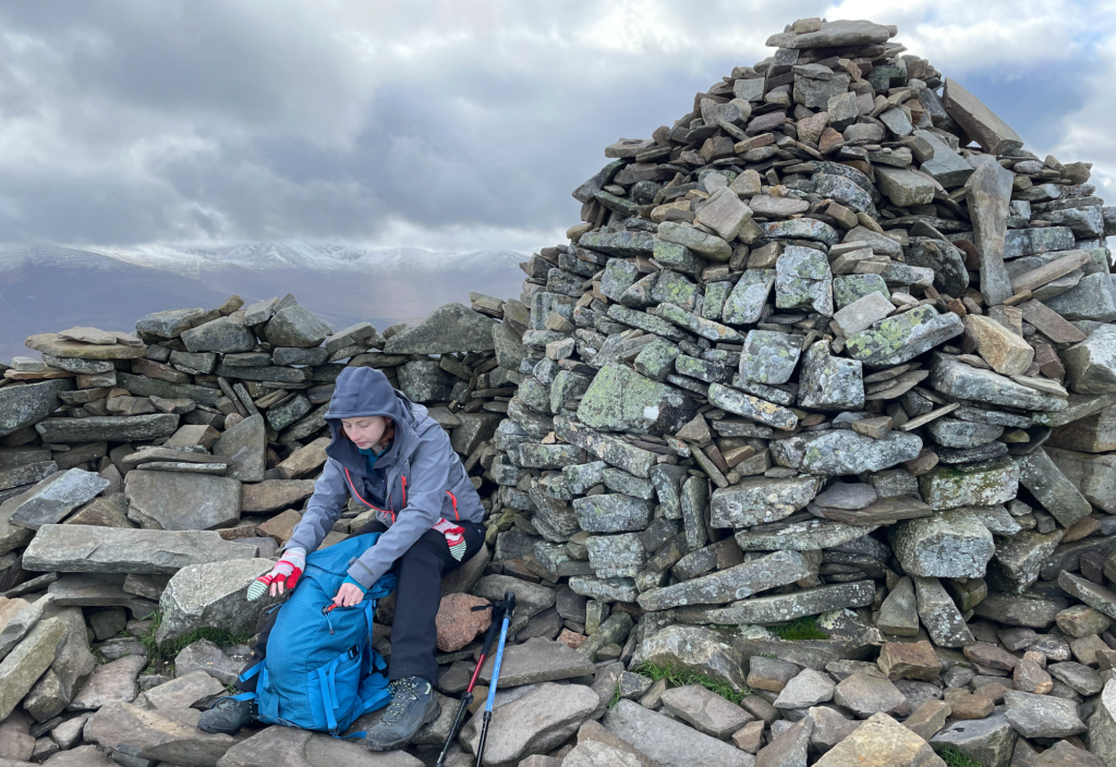 15 Pausing at the substantial cairn and shelter of Meall a' Bhuachaille