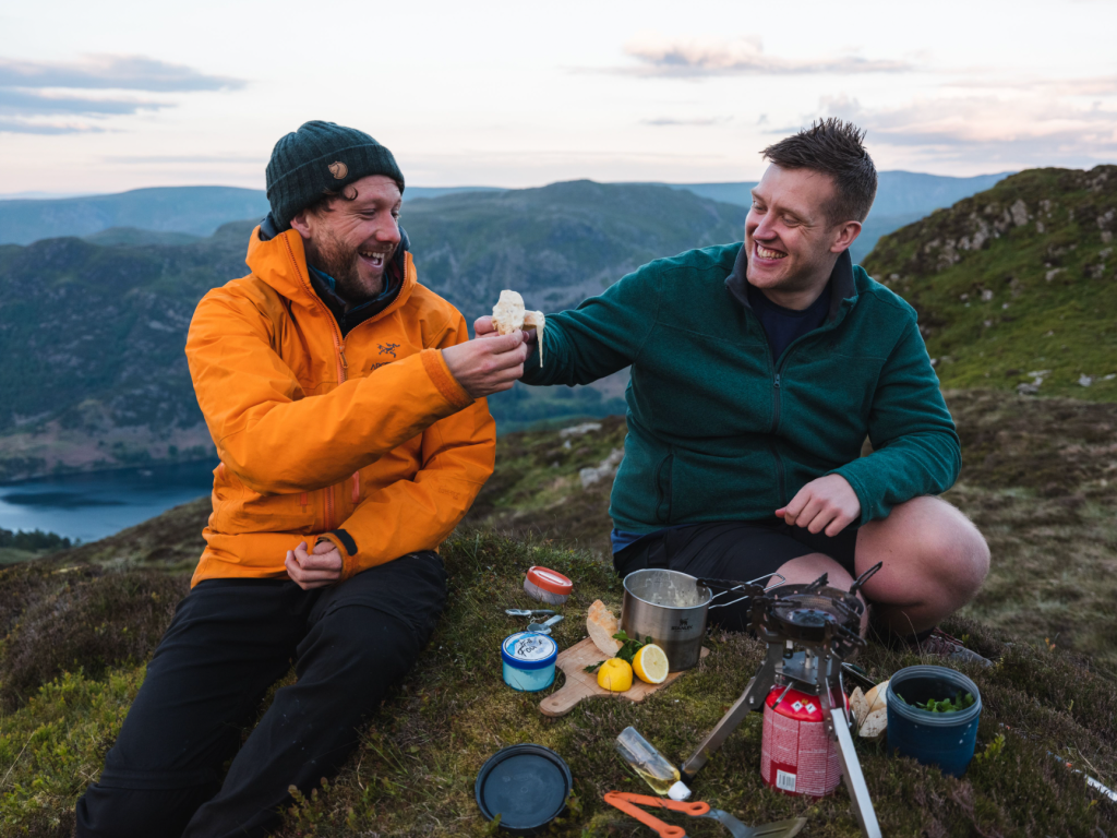 Harrison Ward and Carey Davies dine al fresco on Sheffield Pike. Credit: Daniel Toal