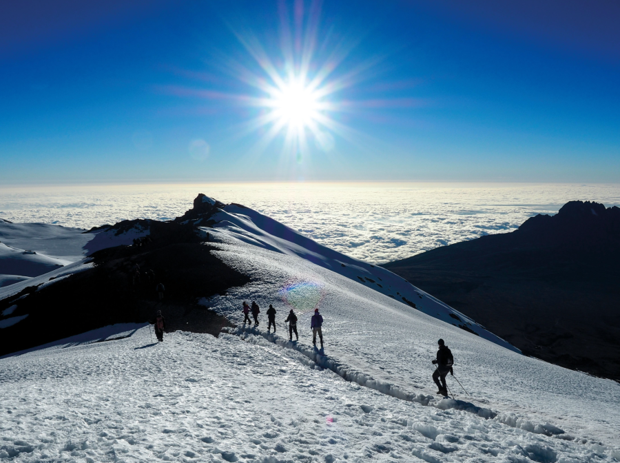 Hikers above the clouds of Kilimanjaro.
