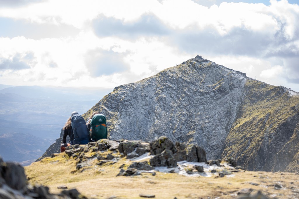Tiny people walking along the Llanberis path to the summit of Yr Wyddfa/Snowdon. Credit: Benjamin Cannon