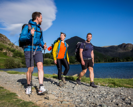 Hiking sandals v boots - three hikers wearing boots and trail shoes