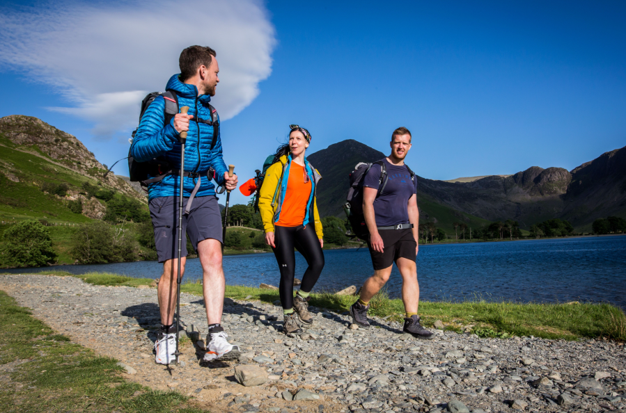 Hiking sandals v boots - three hikers wearing boots and trail shoes