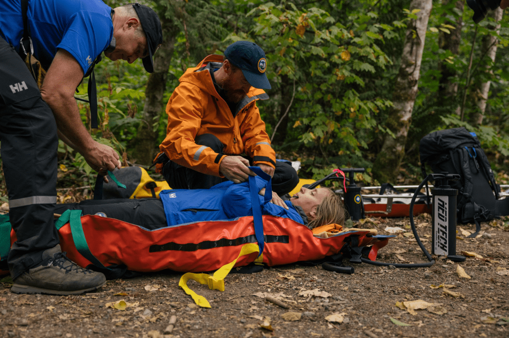 Taking part in a mock rescue operation with Squamish Search and Rescue team | Credit: Michael Overbeck