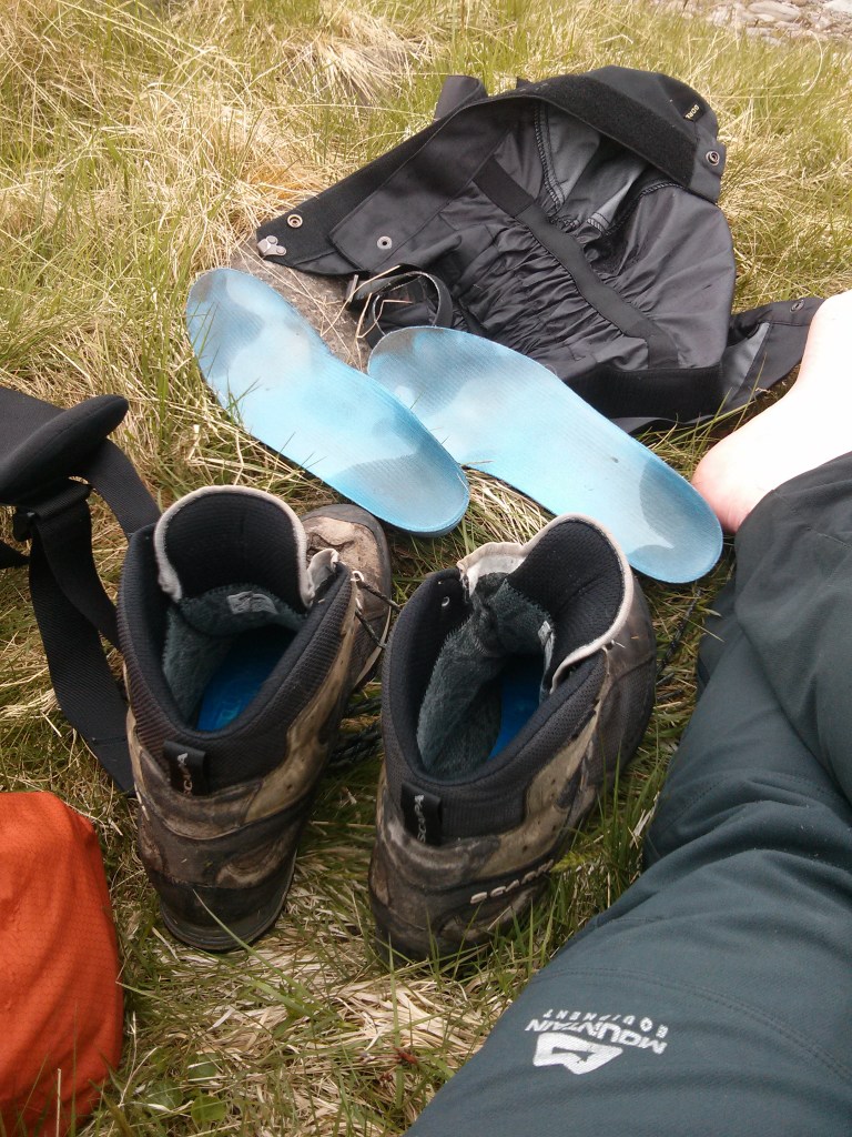 foot care - Drying off boots, insoles and socks after a stream crossing. Credit: Alex Roddie