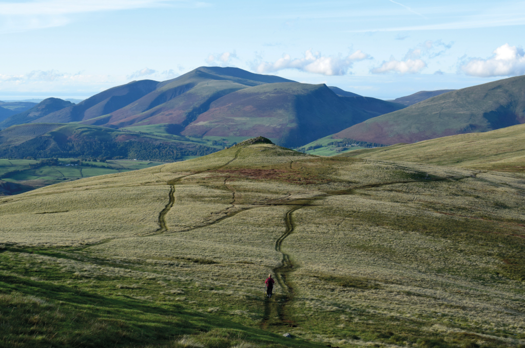 A hiker heading towards Calfhow Pike