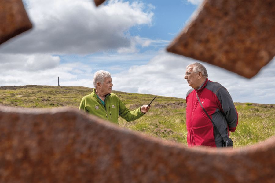 A. Whistleblower Alan McCombes (left) reporting on the Langholm buyout at the Hugh MacDiarmid memorial, 2020 - credit David Lintern