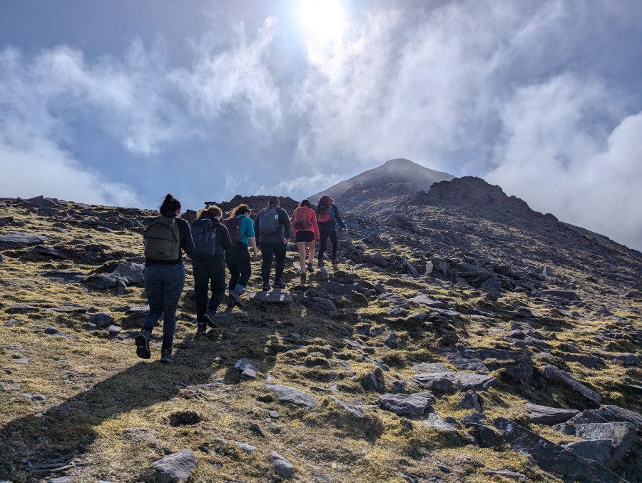 Warming up on the first ascent of the day, led by John. Credit: Francesca Donovan