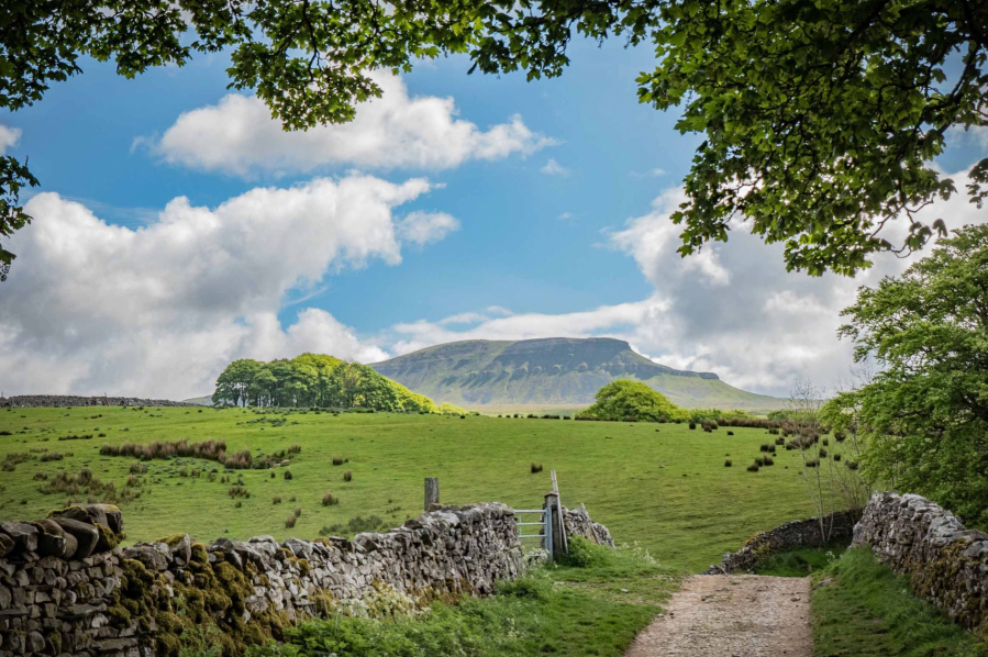A cap of Millstone Grit on limestone forms the distinctive summit of Pen y Ghent in the Yorkshire Dales. Credit - Andy Kay