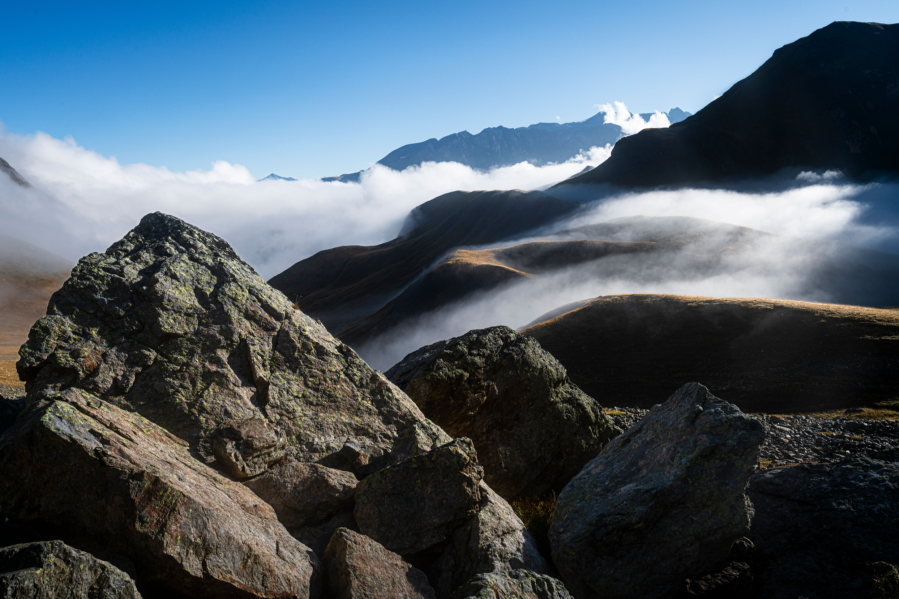 GR54 Écrins National Park - I took a while to line this image up on that final mega inversion morning, getting the rocks in the way in exactly the right way! And, as I did, the clouds draped themselves in ever-more elegant fashion over those velvet folds behind. Mick noticed a marmot on a nearby outcrop watching the same scene unfold, head held up, every bit as transfixed as us. Another existential, magical moment – what was it thinking?! “Just us lil’ guys all here together, trying to figure out this crazy world!” 