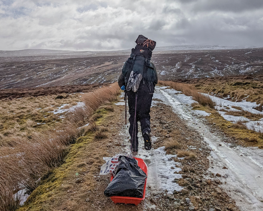 RINSE - Richard dragging a sled of goodies around Cross Fell_credit Juls Stodel