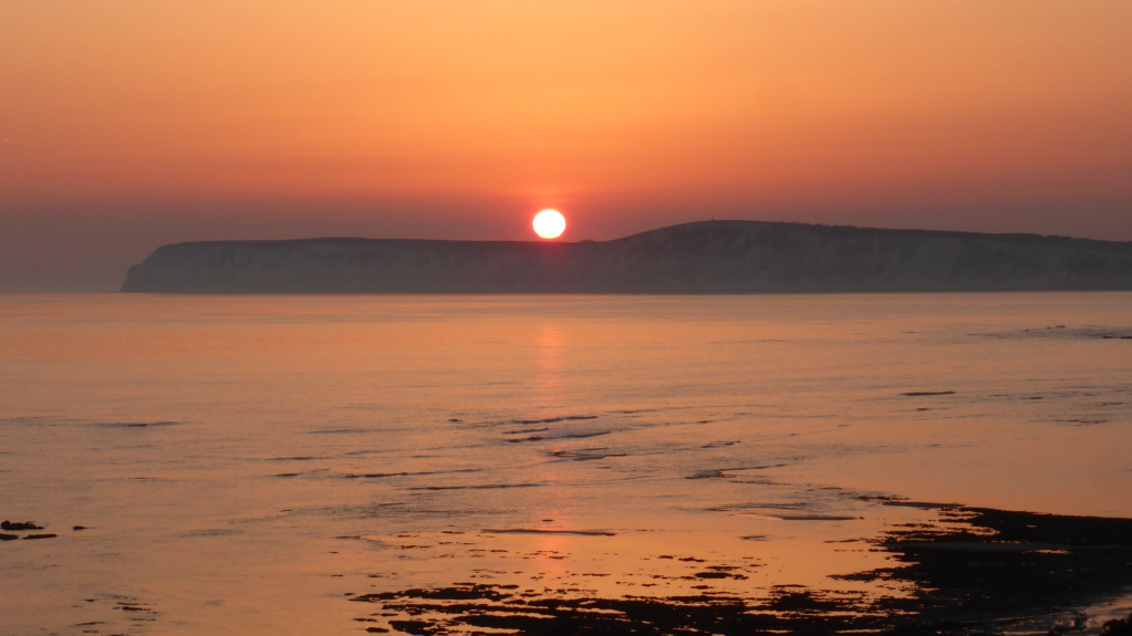 Sunset over Tennyson Down from the Coastal Path. Credit: Fiona Barltrop