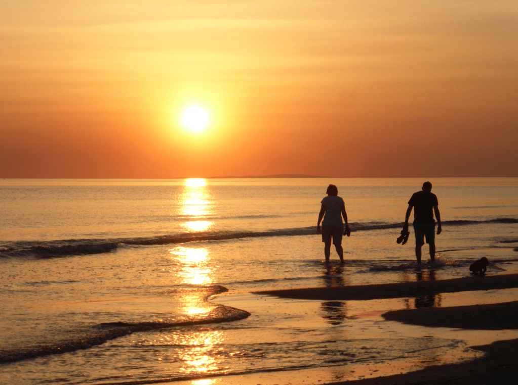Sunset strollers along beach between Aberdovey & Tywyn