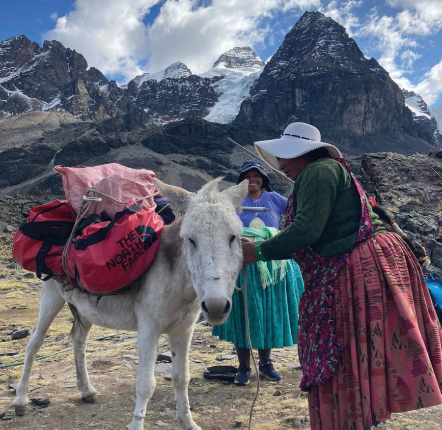 4. Pacesa looks on as her friend, the muleteer, loads our bags onto her mules