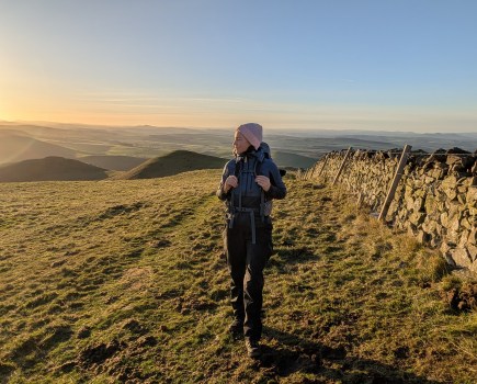 Julia Clarke hiking up Wideopen Hill, the SCW's highest point, in the northern Cheviots