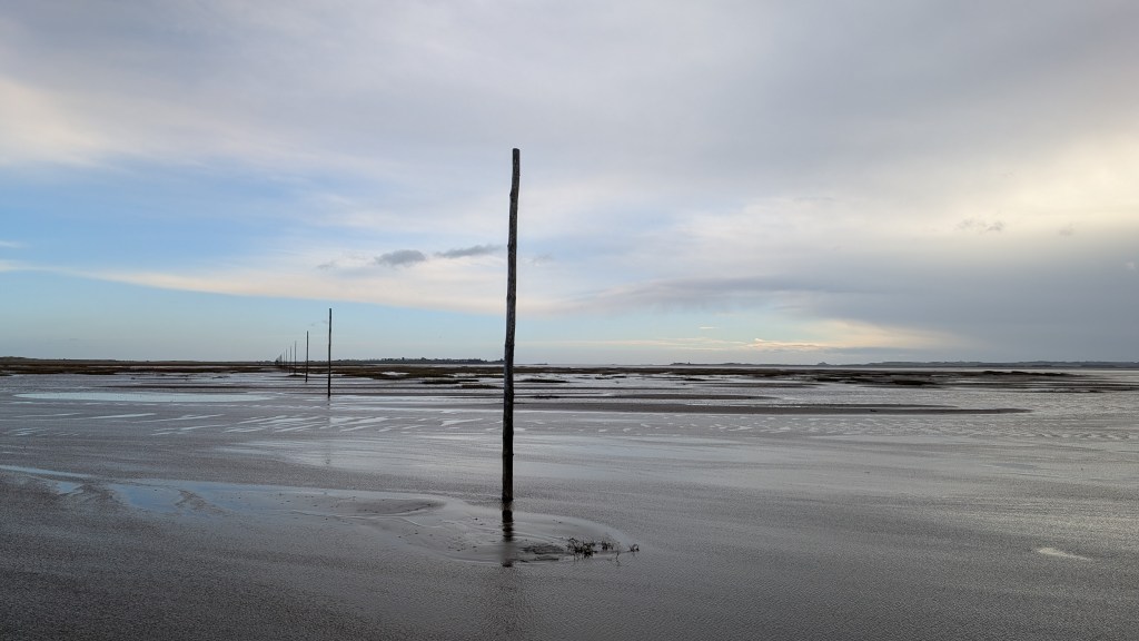 The posts that mark the Pilgrim's Way across the causeway to Lindisfarne