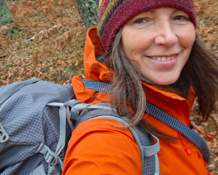 Lucy, happy on winter break with her enduring backpack - credit Lucy Wallace