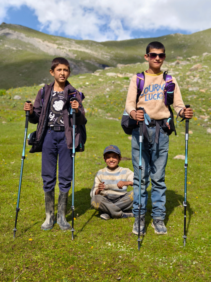 19. Local boys pose with our poles. They were intrigued by our equipment and helped us pitch our tent