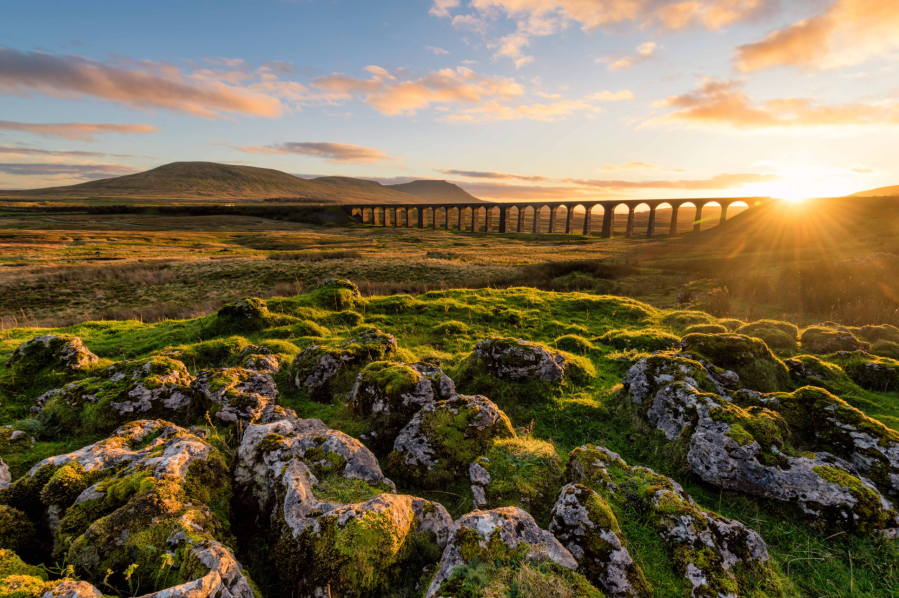 The Ribblehead Viaduct in the Yorkshire Dales straddles the landscape between Ingleborough and Pen-y-Ghent. Credit - Daniel Kay