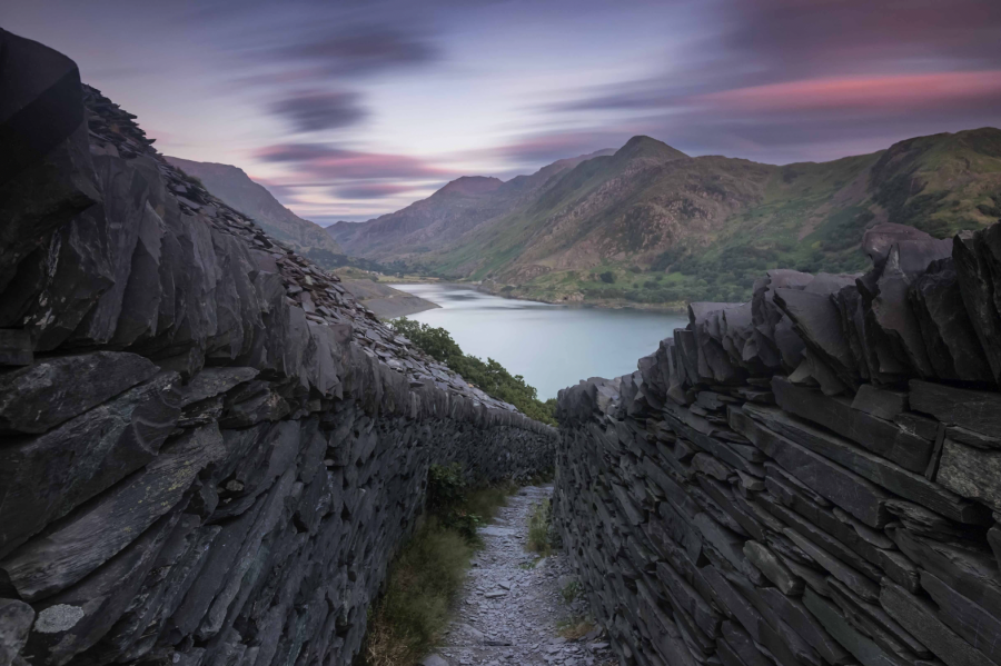 Dry stone walls cut a path through the vast Dinorwic slate quarry on the edge of Eryri (Snowdonia) national park. Credit - Dilwyn Williams