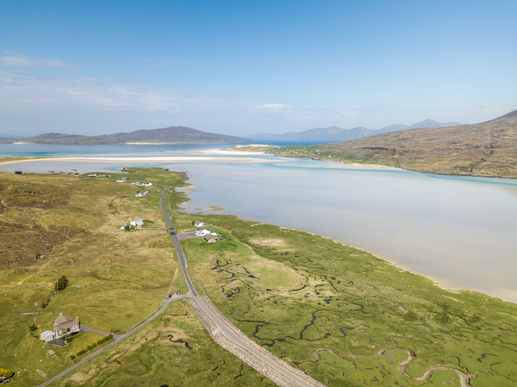 scotlands mountains - The machair near Luskentyre on the Isle of Harris showcases a rare coastal habitat where fertile grasslands meet expansive beaches, a unique ecosystem supporting wildflowers, birds, and insects. Historically, traditional low–intensity grazing and crofting practices maintained this balance. However, like many fragile ecosystems, it faces threats from climate change, rising sea levels, and changing land use practices. The intricate patterns visible from above hint at both the resilience and vulnerability of this ancient landscape. 