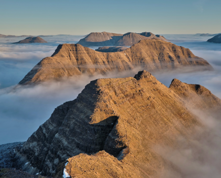 Across the Horns of Alligin from Sgùrr Mòr to Beinn Dearg, middle right, with flat-topped Stùc Loch na Cabhaig, left, Beinn Eighe beyond with Meall a’ Ghiuthais, left, and the distant Fannaichs. (Robert Durran).jpg